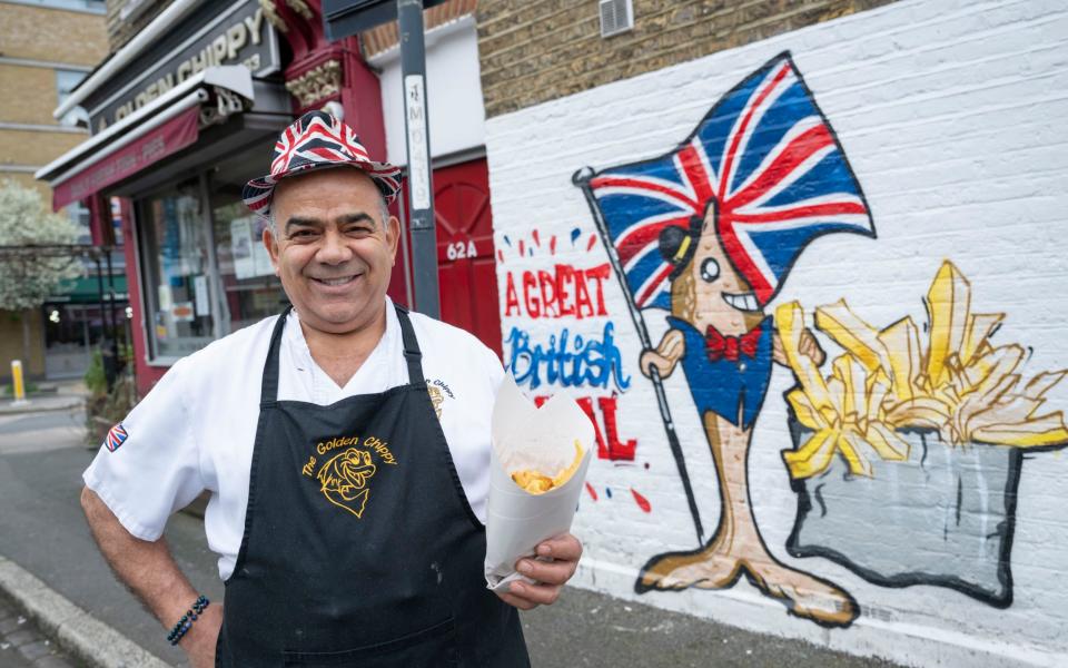 Golden Chippy owner and head chef Kris Kanizi with his patriotic mural