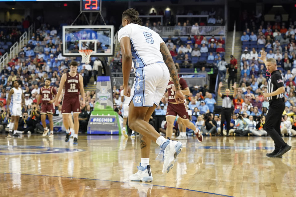 North Carolina forward Armando Bacot (5) hops off the court after injuring his ankle against Boston College during the first half of an NCAA college basketball game at the Atlantic Coast Conference Tournament in Greensboro, N.C., Wednesday, March 8, 2023. (AP Photo/Chuck Burton)