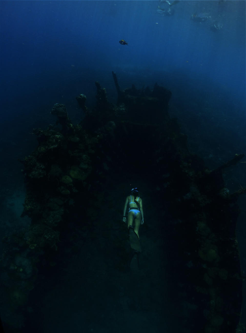 a diver going into a dark cave