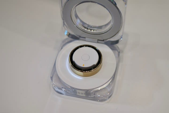 The Samsung Galaxy Ring in its charging case.