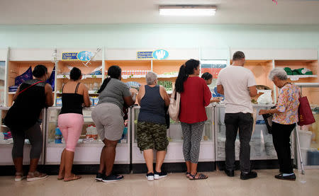 People wait in line to buy goods in a state store in downtown Havana, Cuba, May 10, 2019. REUTERS/Alexandre Meneghini