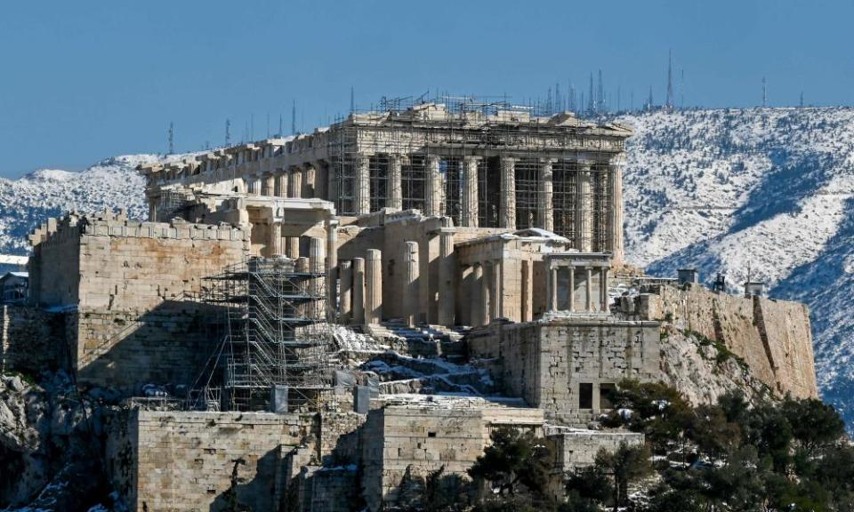 Snow covers the Acropolis in central Athens.