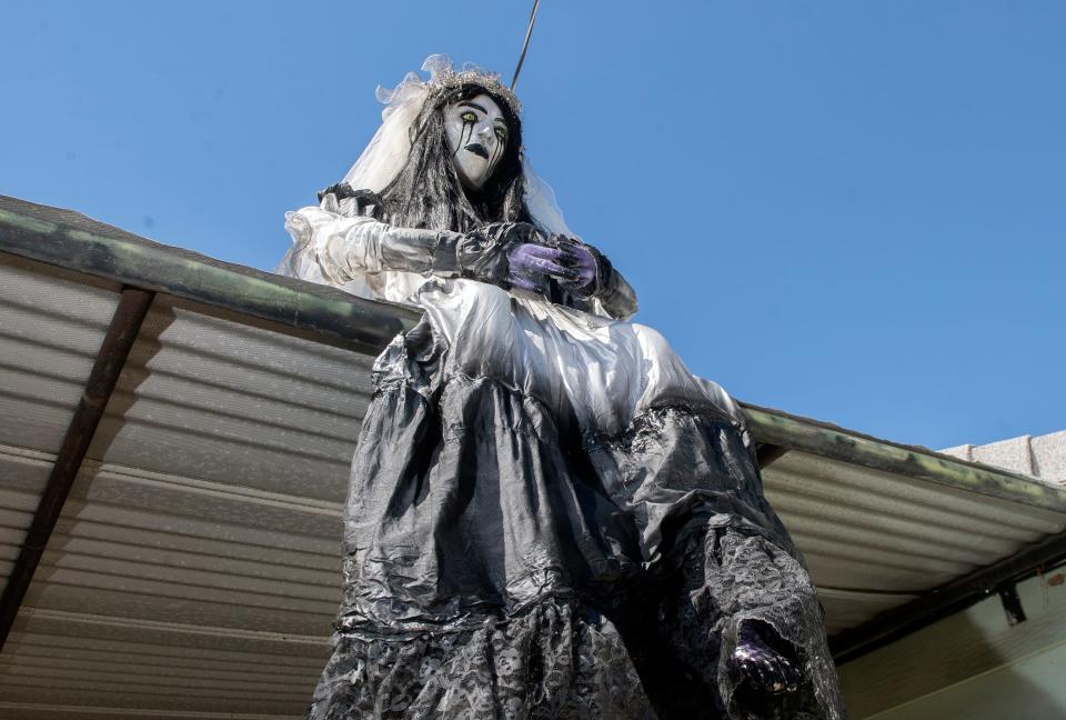 A ghostly waif sits on the roof of the carport at Jeanna Pack's home on Oto Avenue near Farm Street in east Stockton on Thursday, Sept. 22, 2022. Pack has been doing elaborate Halloween displays at her home for the past 26 years. CLIFFORD OTO/THE STOCKTON RECORD