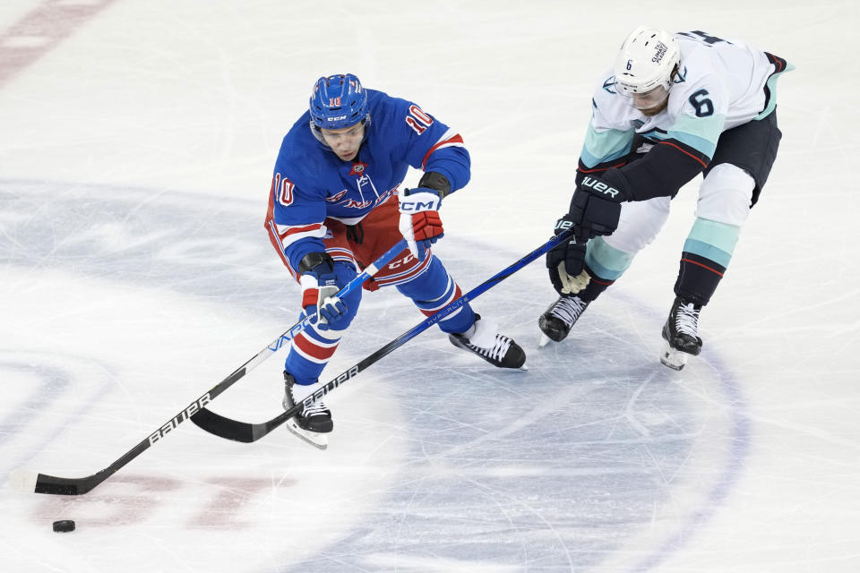 New York Rangers left wing Artemi Panarin (10) skates against Seattle Kraken defenseman Adam Larsson (6) during the third period of an NHL hockey game, Tuesday, Jan. 16, 2024, at Madison Square Garden in New York. (AP Photo/Mary Altaffer)