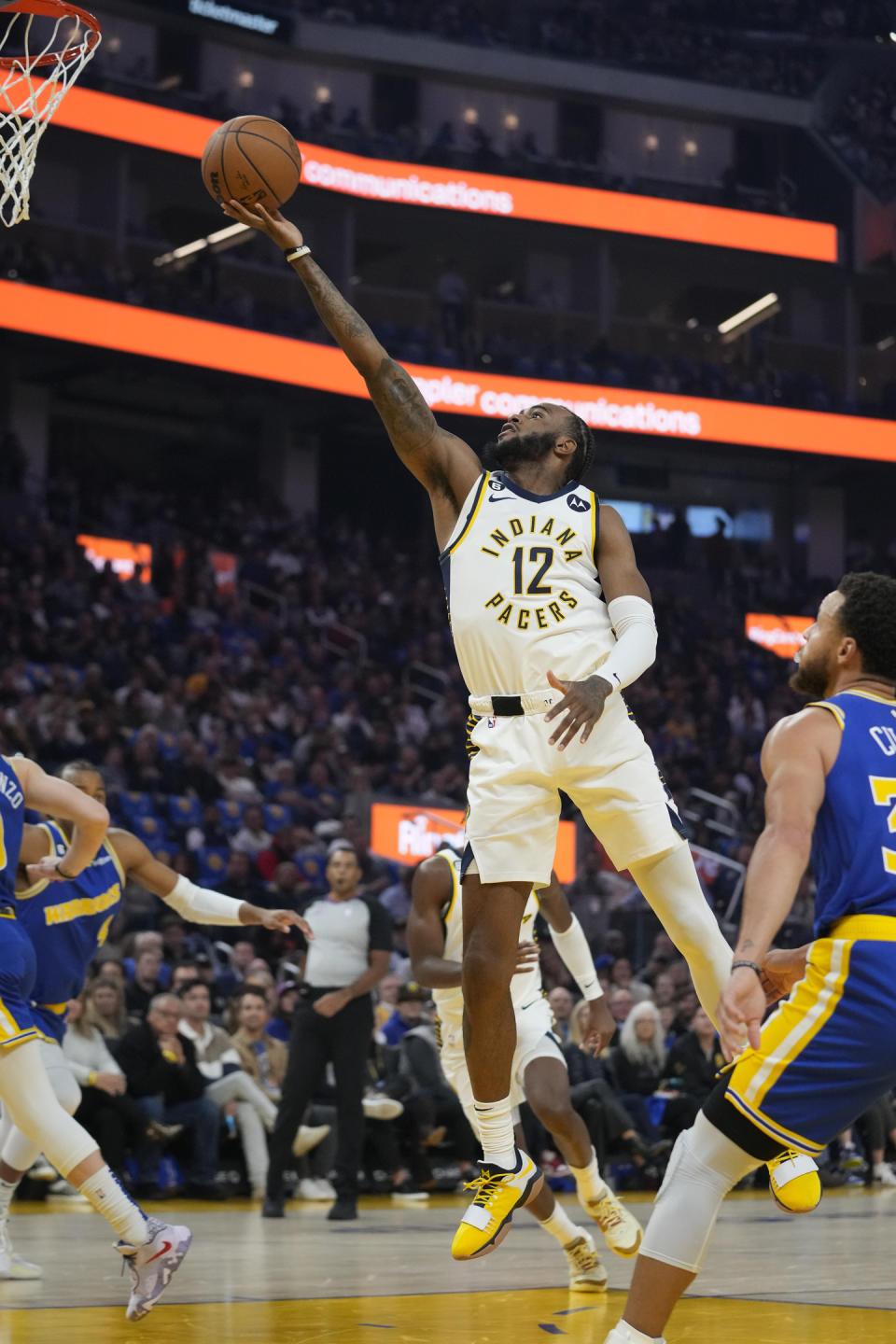 Indiana Pacers forward Oshae Brissett (12) shoots against the Golden State Warriors during the first half of an NBA basketball game in San Francisco, Monday, Dec. 5, 2022. (AP Photo/Godofredo A. Vásquez)