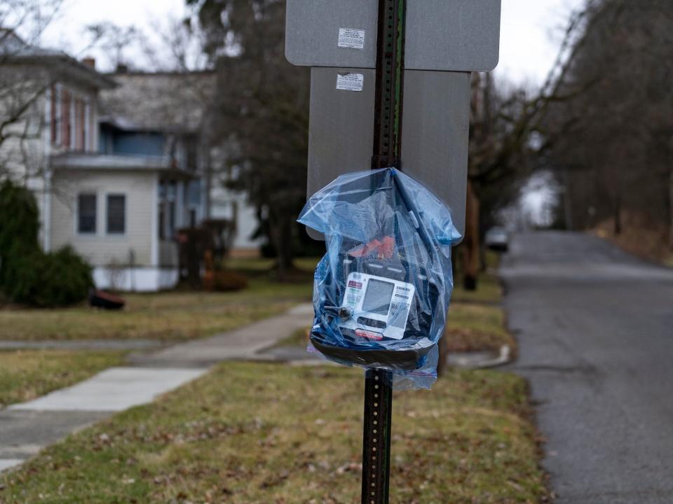 An air quality monitor hangs on a stop sign near the site of a train derailment prompting health concerns on February 17, 2023 in East Palestine, Ohio. On February 3rd, a Norfolk Southern Railways train carrying toxic chemicals derailed causing an environmental disaster. Thousands of residents were ordered to evacuate after the area was placed under a state of emergency and temporary evacuation orders.