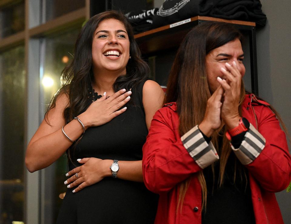 Framingham School Committee Chair Priscila Sousa, left, celebrates with her mother, Luciana Sousa, at Buckley Kitchen & Bar after hearing she had won the Democratic nomination in the newly redrawn 6th Middlesex District race, Sept. 6, 2022.