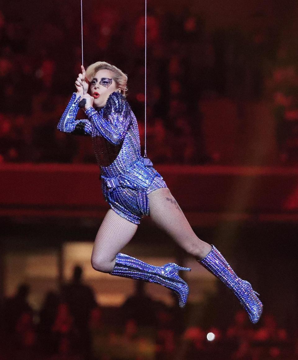 Flying high: Lady Gaga was lowered down from the roof (Tannen Maury/EPA)