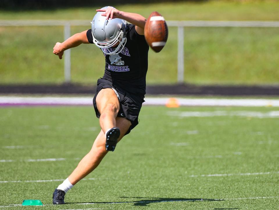 Bloomington South's Bryce Taylor attempts a kick during the first day of football practice at South on Monday, July 31, 2023.