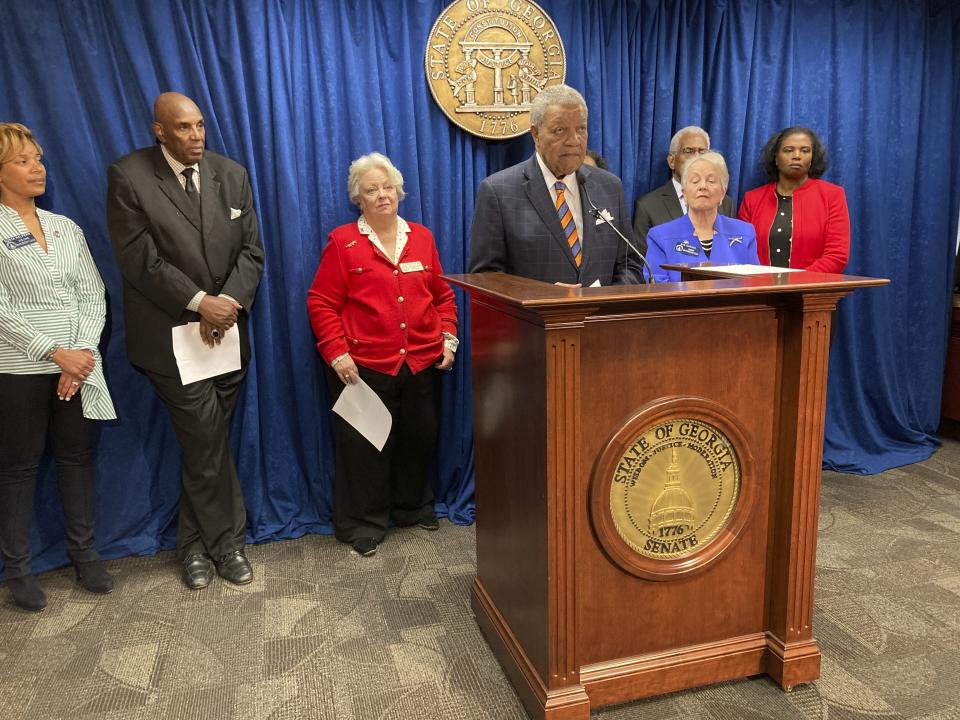 Fulton County Commission Chairman Robb Pitts, flanked by supporters, announces federal complaints against Wellstar Health System, Wednesday, March 8, 2023, at the Georgia Capitol in Atlanta. Pitts says Wellstar violated federal anti-discrimination law and its nonprofit status when it closed Atlanta Medical Center in 2022. (AP Photo/Jeff Amy)