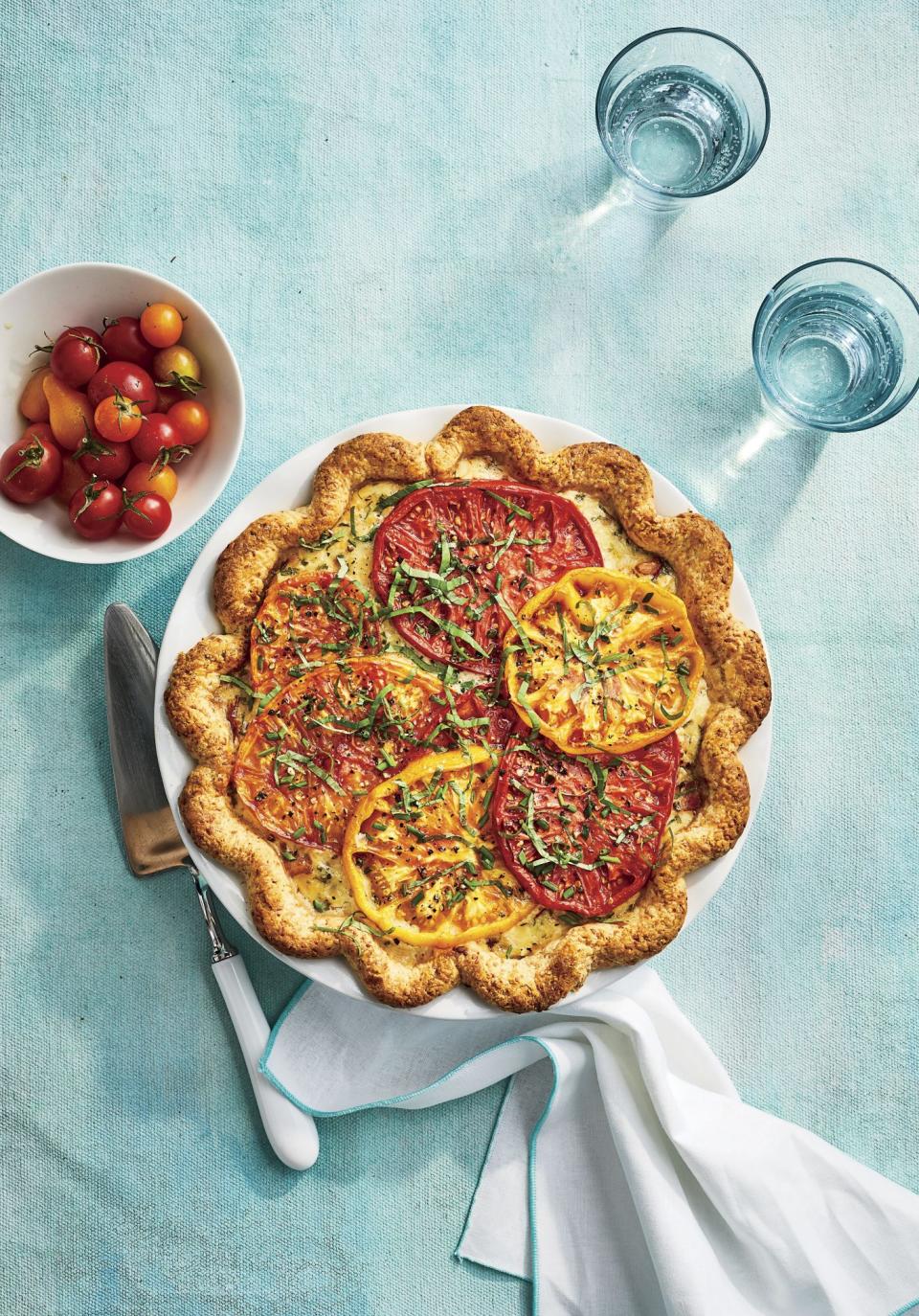 <p><strong>Recipe: </strong><a href="https://www.southernliving.com/recipes/heirloom-tomato-pie" rel="nofollow noopener" target="_blank" data-ylk="slk:Heirloom Tomato Pie;elm:context_link;itc:0;sec:content-canvas" class="link "><strong>Heirloom Tomato Pie</strong></a></p> <p>If our readers aren’t whipping up a BLT with their summer harvest of tomatoes, they’re making tomato pie. This totally-from-scratch recipe starts with a parmesan-buttermilk crust and ends with a sprinkle of fresh herbs from the garden. Readers found ways to adapt the recipe with store-bought crusts and whatever cheese they had on hand.</p>