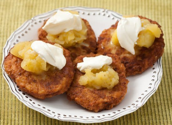 Hanukkah wouldn't be complete without potato latkes, brown and crispy right out of the frying pan. Make a big batch of latkes for your family and guests and keep them warm in the oven for up to 1 hour. Serve with applesauce, sour cream or both.    <strong>Get the <a href="http://www.huffingtonpost.com/2011/10/27/crispy-potato-latkes_n_1059382.html" target="_hplink">Crispy Potato Latkes</a> recipe</strong>