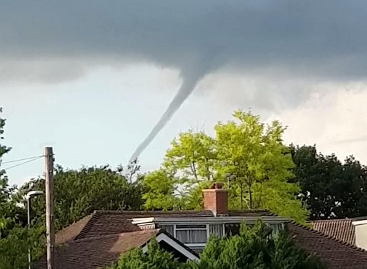 Simon Mackie, 54, was putting his recycling bins out when he looked up to see the rare cloud formation yesterday evening. (SWNS)