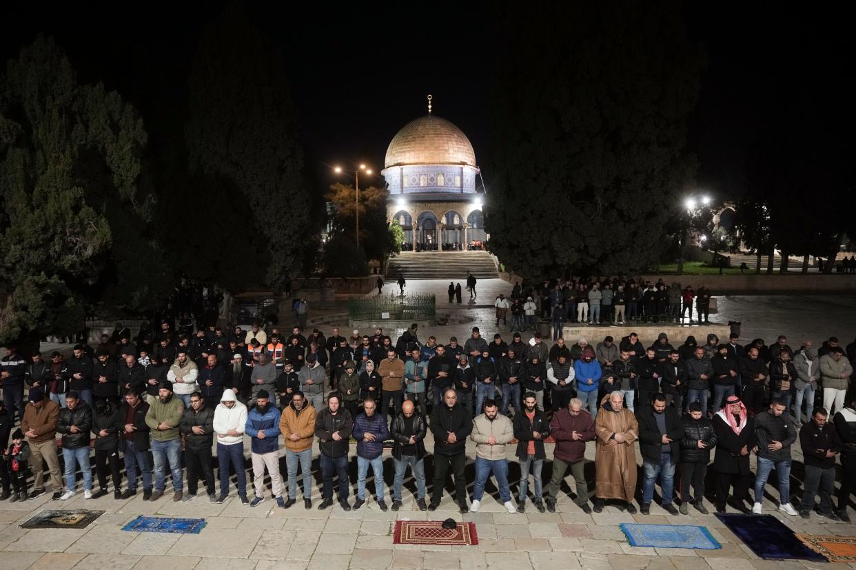 Muslim worshippers perform "tarawih," a lengthy prayer held during the Muslim holy month of Ramadan, next to the Dome of Rock at the Al-Aqsa Mosque compound in the Old City of Jerusalem on March 10, 2024.