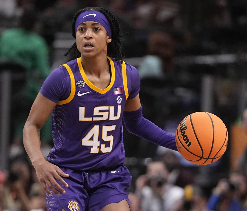 FILE - LSU's Alexis Morris controls the ball during an NCAA Women's Final Four semifinal basketball game against Virginia Tech, March 31, 2023, in Dallas. Former LSU star Morris knows firsthand how hard it is to make a WNBA roster. The guard was drafted in the second round by the Connecticut Sun a few weeks after helping the Tigers win their first championships in 2023, but was cut before the season started. (AP Photo/Darron Cummings, File)