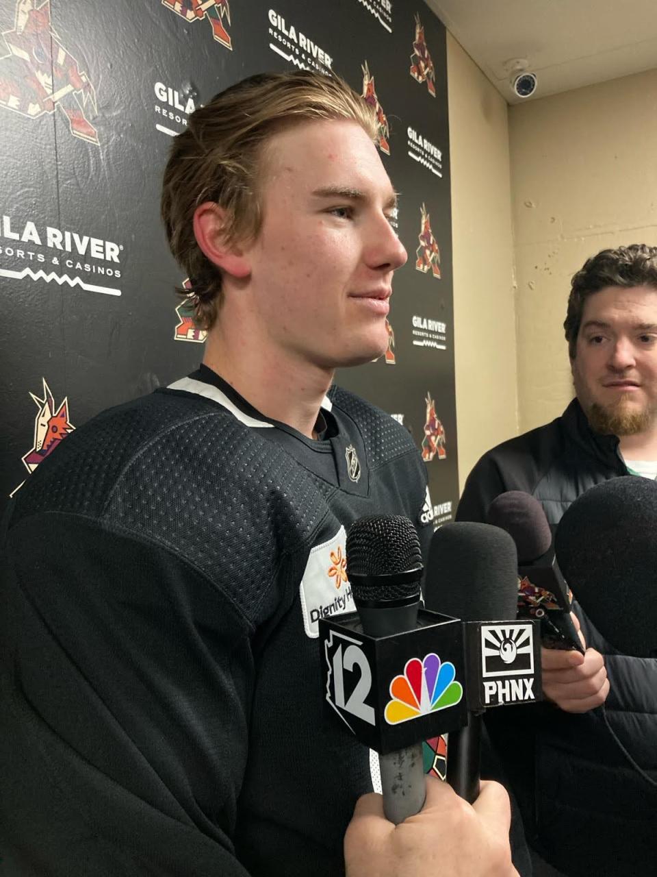 Arizona Coyotes forward Josh Doan speaks to the media about his NHL debut on March 26, 2024, against the Columbus Blue Jackets following morning skate.