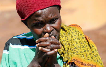 A survivor reacts near destroyed houses by flooding water after a dam burst, in Solio town near Nakuru, Kenya May 10, 2018. REUTERS/Thomas Mukoya