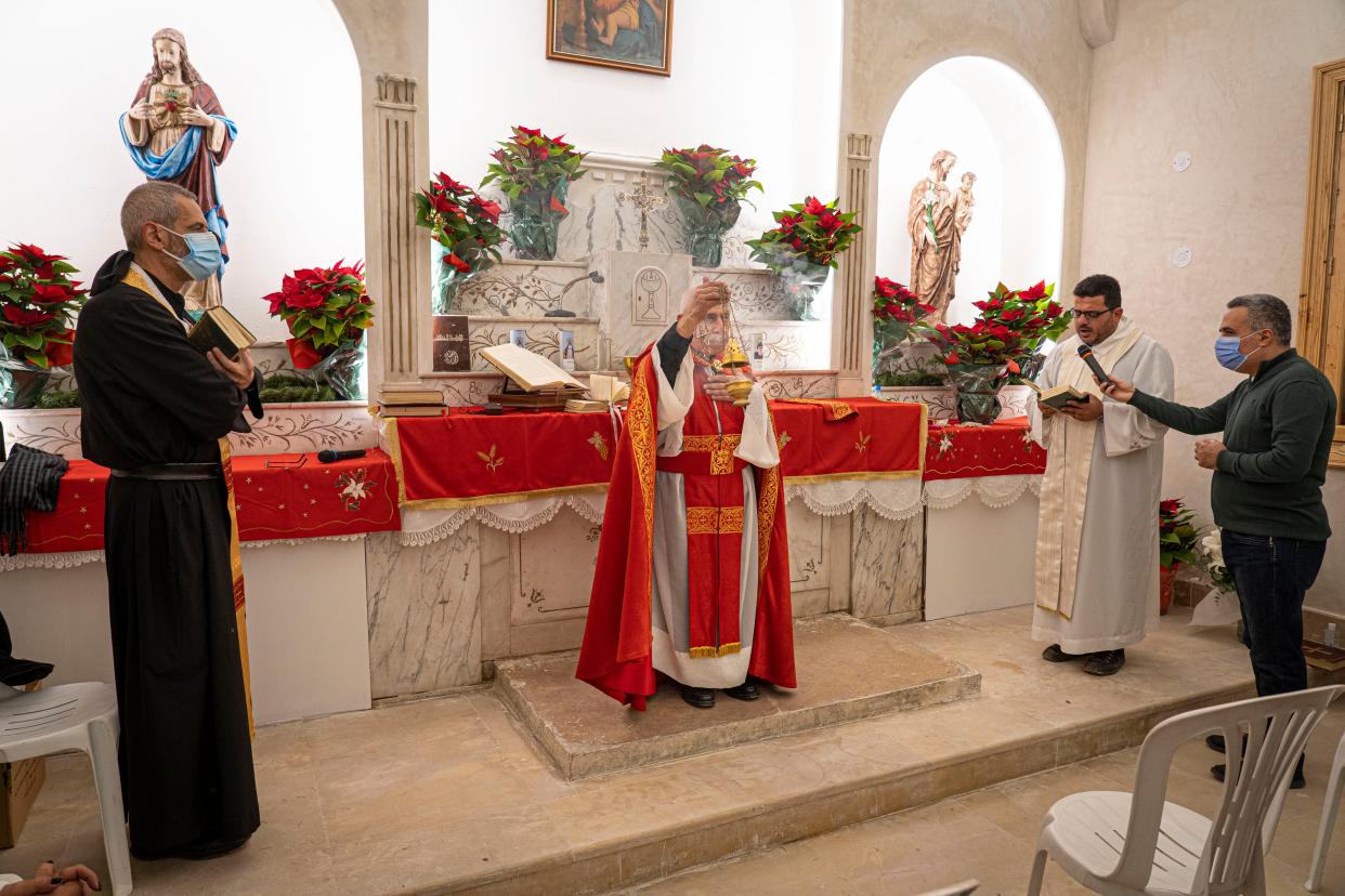 Lebanese Christians celebrate Christmas Eve mass in a recently rebuilt church that was destroyed  in the Beirut blast (Bel Trew)