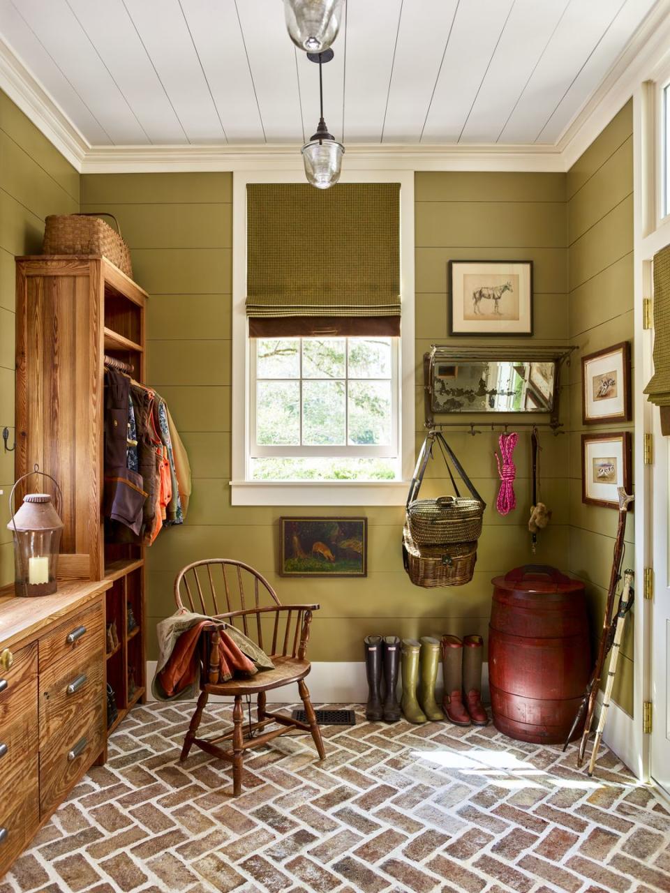 <p>With floors these gorgeous, the walls in this mini mudroom need to pack just as big of an impact. A soft olive green like <a href="https://www.sherwin-williams.com/homeowners/color/find-and-explore-colors/paint-colors-by-family/SW6705-high-strung" rel="nofollow noopener" target="_blank" data-ylk="slk:High Strung by Sherwin-Williams;elm:context_link;itc:0;sec:content-canvas" class="link ">High Strung by Sherwin-Williams</a> sets the scene for a day full of fun outdoor activities.</p>