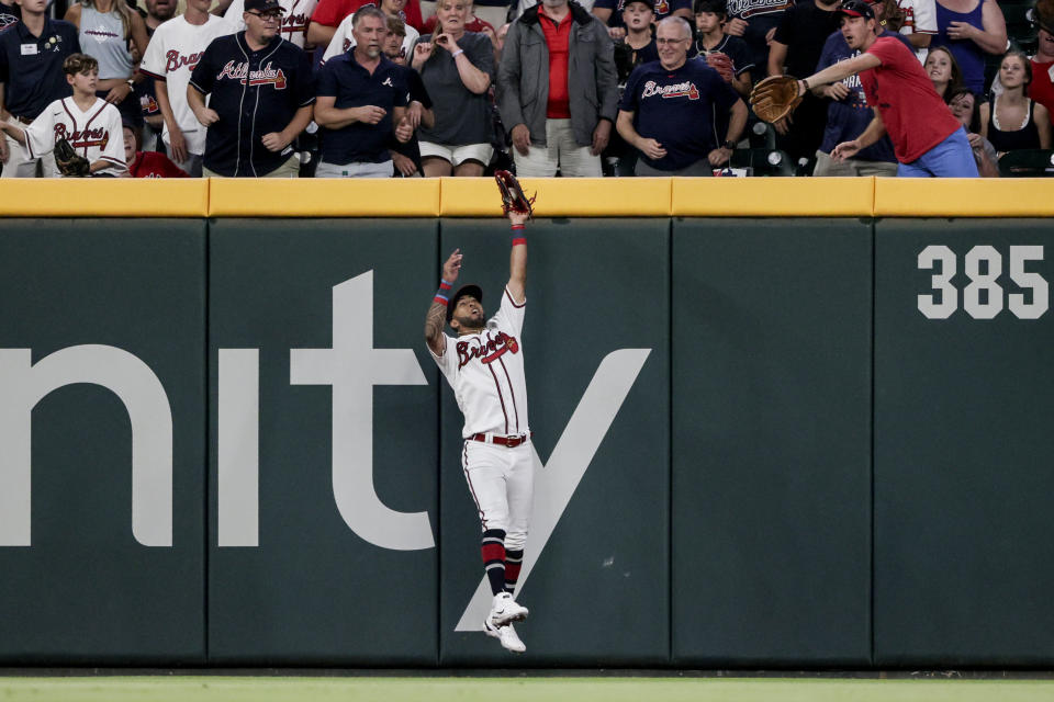 Atlanta Braves right fielder Eddie Rosario catches the ball for the out on Arizona Diamondbacks' Christian Walker during the ninth inning of a baseball game Saturday, July 30, 2022, in Atlanta. (AP Photo/Butch Dill)