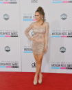 Kimberly Cole arrives on the 2012 American Music Awards red carpet.