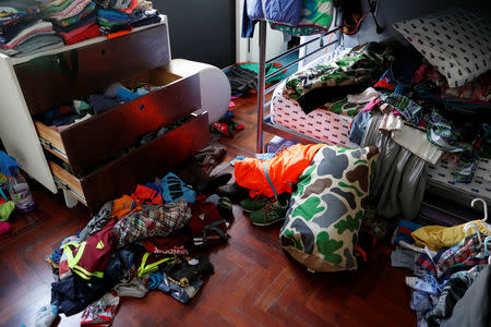 Clothing and personal belongings are seen on the floor of a room at the residence of opposition leader Leopoldo Lopez and his family, after unidentified government officials illegally entered the house, according to the family's lawyer Omar Mora Tosta, in Caracas, Venezuela May 2, 2019. REUTERS/Carlos Garcia Rawlins