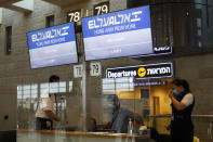 A screen displaying flight number of Israeli flag carrier El Al's airliner which will carry Israeli and U.S. delegations to Abu Dhabi for talks meant to put final touches on the normalization deal between the United Arab Emirates and Israel, at Ben Gurion Airport, near Tel Aviv, Israel Monday, Aug. 31, 2020. (Nir Elias/Pool Photo via AP)