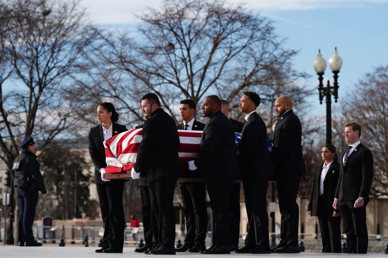 Pallbearers arrive at the U.S. Supreme Court carrying the flag-draped casket of retired Supreme Court Justice Sandra Day O'Connor on Monday. Photo by Bonnie Cash/UPI