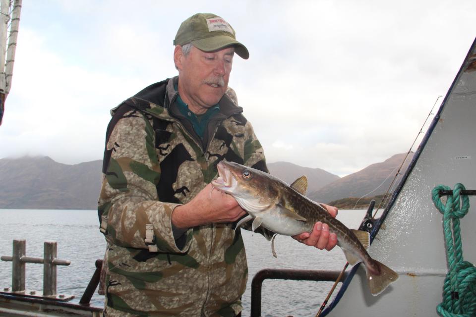 Jim Wipperfurth holds a Pacific cod caught Oct. 6 while fishing off Kodiak Island Alaska.