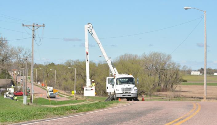 Watertown Municipal Utilities workers work on a fallen power line near Lake Kampeska Friday. Damage across the region was reported after Thursday night&#39;s storms.