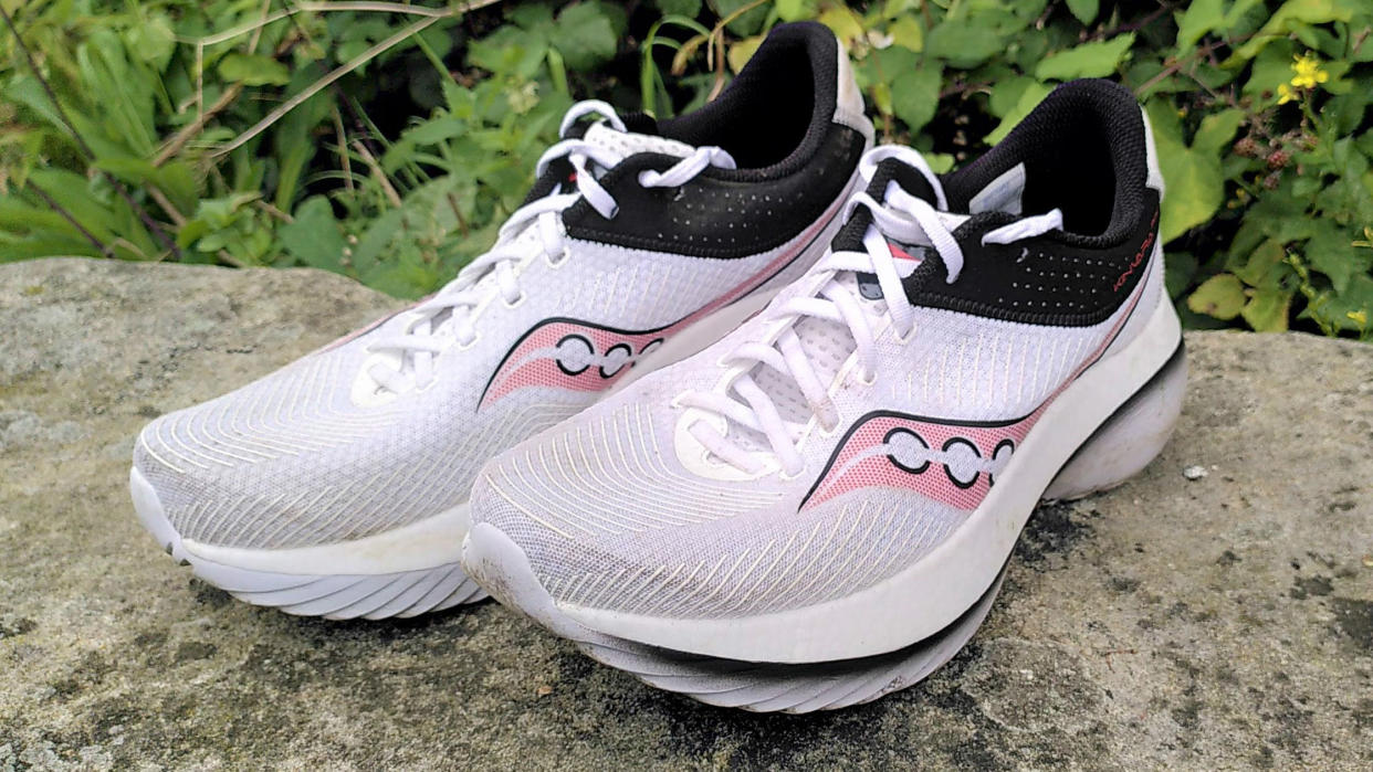  Saucony Kinvara Pro running shoes on stone wall 