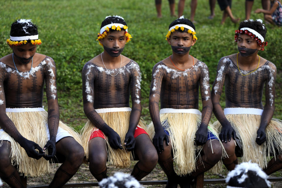 Indigenous boys prepare to take part in a ritual during the final and most symbolic day of the Wyra'whaw coming-of-age festival at the Ramada ritual center, in the Tenetehar Wa Tembe village, located in the Alto Rio Guama Indigenous territory in Para state, Brazil, Sunday, June 11, 2023. (AP Photo/Eraldo Peres)