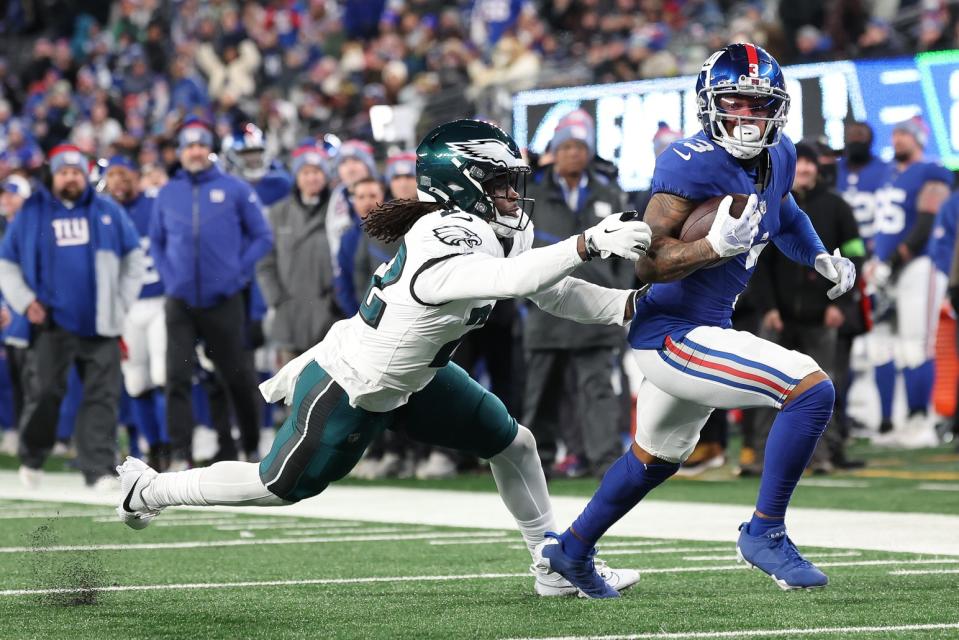 Jan 7, 2024; East Rutherford, New Jersey, USA; New York Giants wide receiver Sterling Shepard (3) is tackled by Philadelphia Eagles cornerback Kelee Ringo (22) during the second half at MetLife Stadium. Mandatory Credit: Vincent Carchietta-USA TODAY Sports