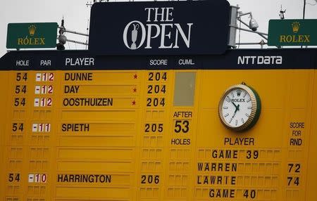 The scoreboard shows Paul Dunne of Ireland at the top during the third round of the British Open golf championship on the Old Course in St. Andrews, Scotland, July 19, 2015. REUTERS/Russell Cheyne