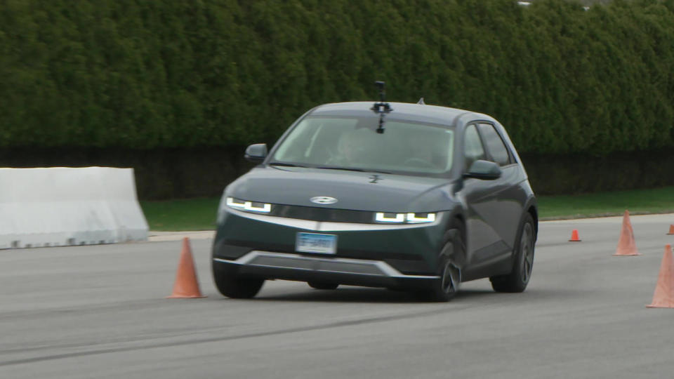 Test-driving a car on Consumer Reports' six-mile-long auto test track in Connecticut.  / Credit: CBS News