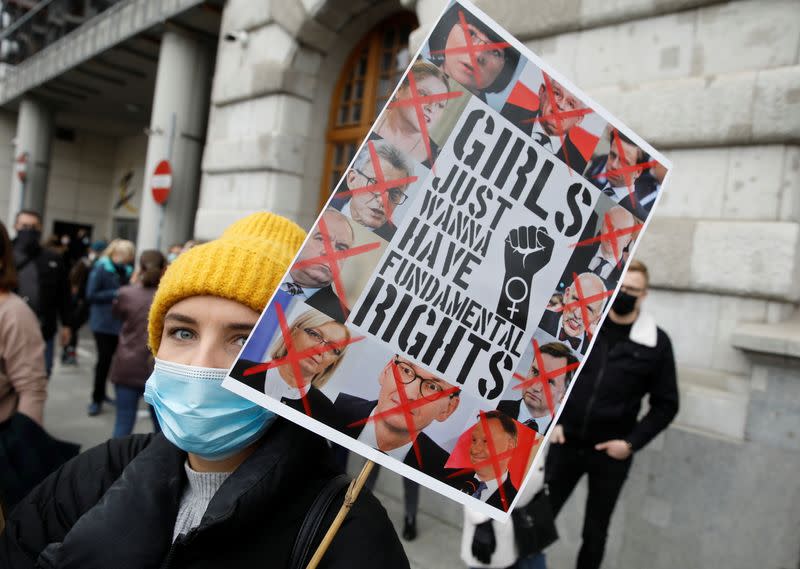 A woman takes part in a protest against the ruling by Poland's Constitutional Tribunal that imposes a near-total ban on abortion in Warsaw