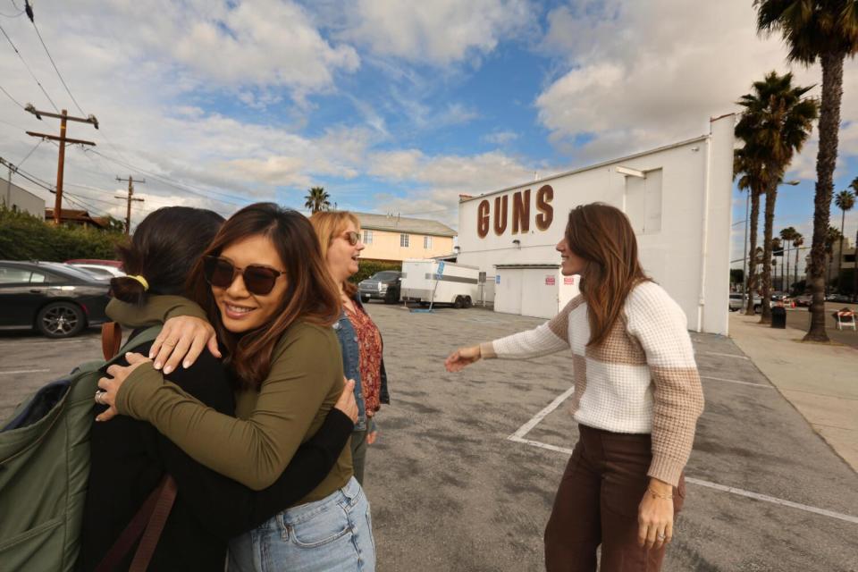 Members of Culver 878, a local anti-gun advocacy group, celebrate the closing of the Martin B. Retting gun store.