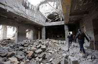 Iraqi Federal Police walk inside Mosul train station in the city of Mosul. REUTERS/Youssef Boudlal