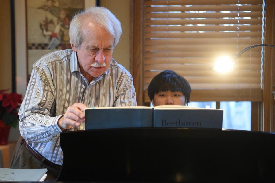 Haruki Takeuchi receives feedback from piano teacher David Northington, in Northington’s West Knoxville home, Thursday, Dec. 7, 2023.