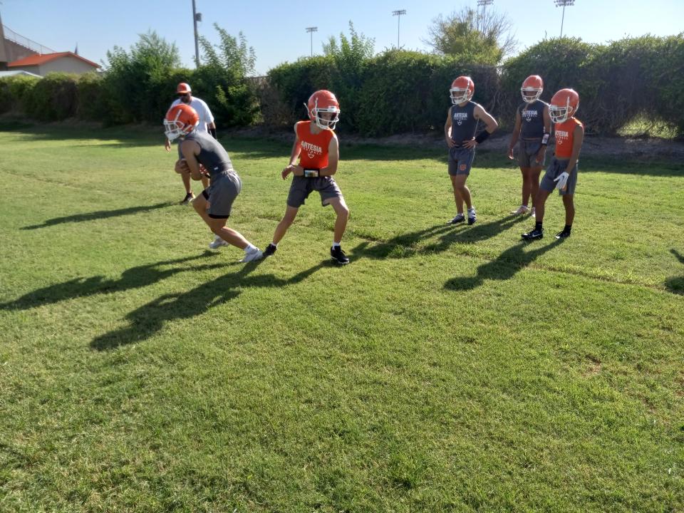 Artesia High School football players participate in the start of two-a-day workouts on July 31, 2023.