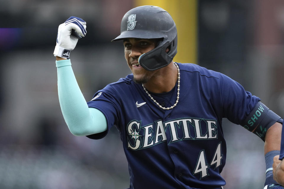 Seattle Mariners' Julio Rodriguez celebrates his RBI single against the Detroit Tigers in the second inning of a baseball game, Friday, May 12, 2023, in Detroit. (AP Photo/Paul Sancya)