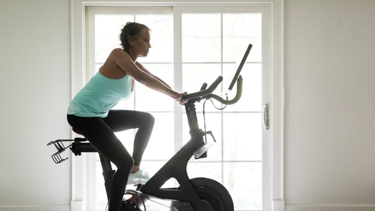 senior woman on exercise bike