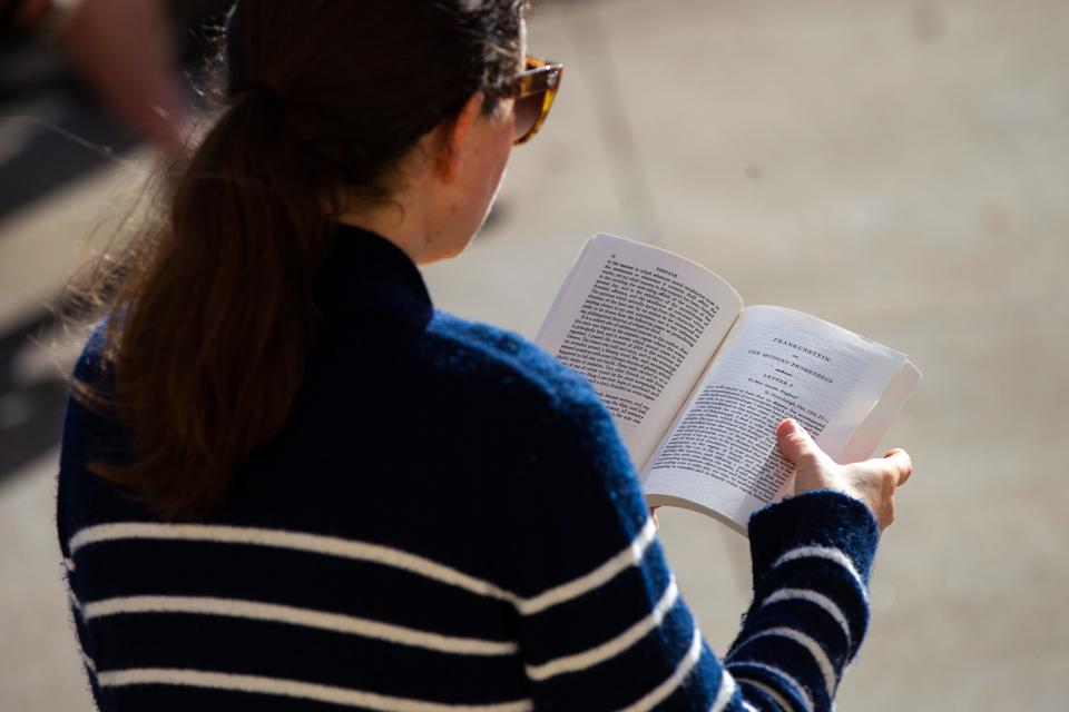 Kathrine Moermond, education  and outreach Coordinator at the Old Capitol Museum, reads from "Frankenstein" by Mary Shelley on Wednesday, Oct. 3, 2018, on the east steps of the Old Capitol on the Pentacrest in Iowa City. Volunteers began reading the 1818 novel at 9 a.m. and planned on finishing by 6 p.m.