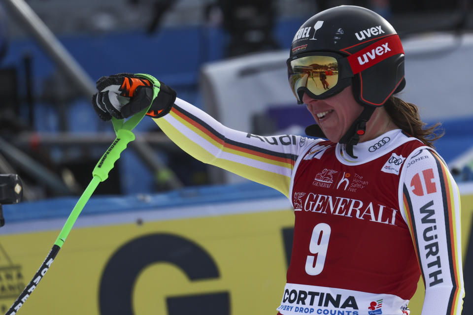 Germany's Kira Weidle gets to the finish area after completing an alpine ski, women's World Cup downhill race, in Cortina d'Ampezzo, Italy, Friday, Jan. 20, 2023. (AP Photo/Alessandro Trovati)