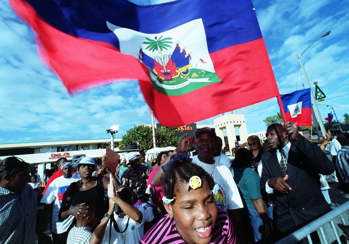 In this file photo, 250 Haitian protesters gather in front of what was the Immigration and Naturalization Service building on Northwest 79th Street in Miami demonstrating against repatriating Haitian boat people.