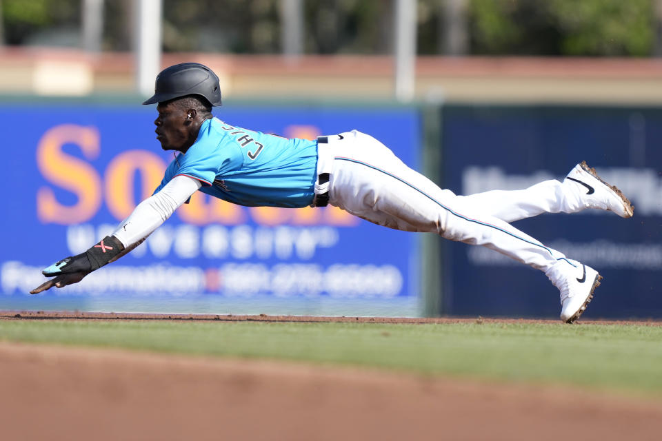 Miami Marlins' Jazz Chisholm Jr. steal second base during the first inning of a spring training baseball game against the Tampa Bay Rays, Saturday, March 11, 2023, in Jupiter, Fla. (AP Photo/Lynne Sladky)
