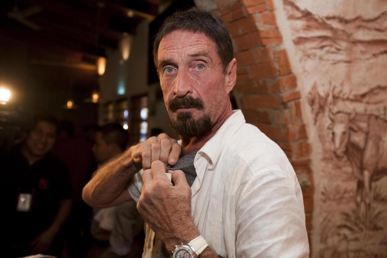 Bitcoin shill John McAfee, who's on the run from the law for tax evasion, taunted the U.S. government on Twitter, saying they better leave him alone. | Source: AP Photo/Moises Castillo