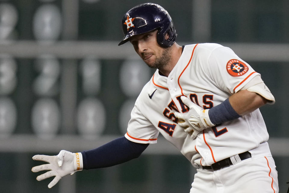 Houston Astros' Alex Bregman reacts after hitting a two-run double during the third inning of the team's baseball game against the Cleveland Guardians, Tuesday, May 24, 2022, in Houston. (AP Photo/Eric Christian Smith)