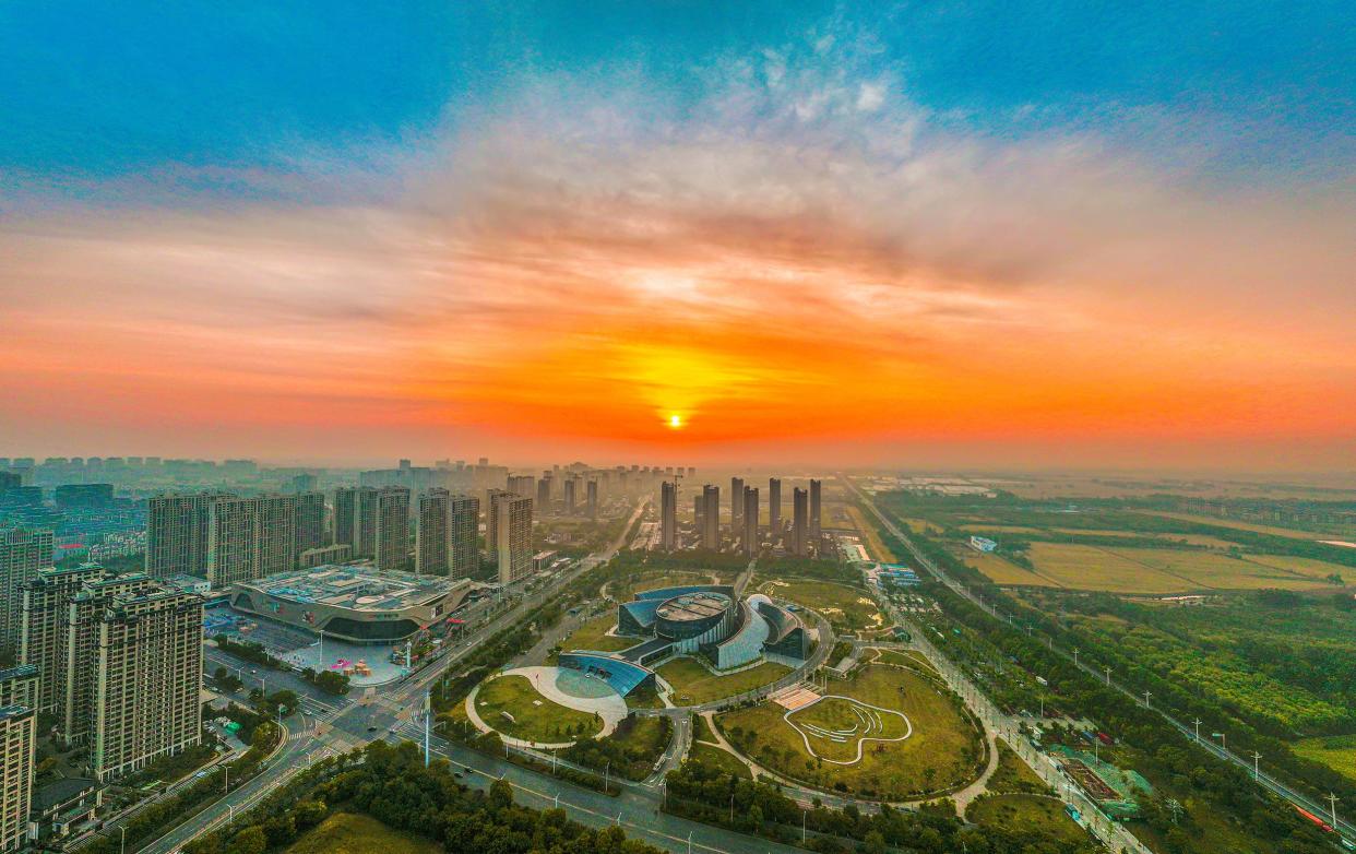 A property is under construction under the rising sun in Suqian, Jiangsu.