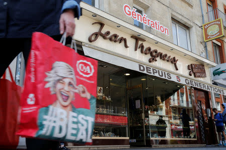 A woman walks past the Jean Trogneux, chocolate shop in Amiens, France, May 16, 2019. Picture taken May 16, 2019. REUTERS/Pascal Rossignol